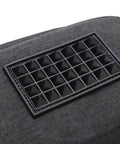 Close-up of non-slip feet on Vinyl Record Storage Bag With Cationic Fabric Thick Padded Base Dual Zippers Removable Dividers Travel Case for DJs.