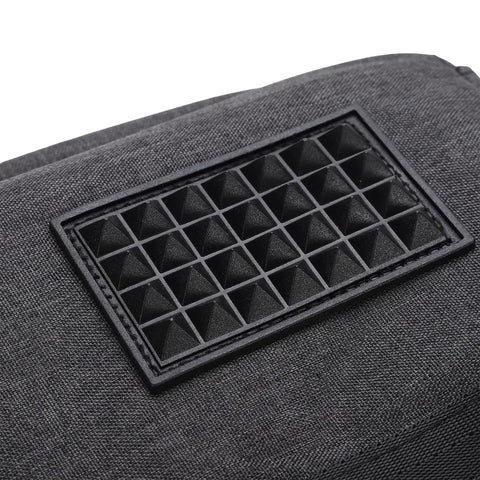 Close-up of non-slip feet on Vinyl Record Storage Bag With Cationic Fabric Thick Padded Base Dual Zippers Removable Dividers Travel Case for DJs.