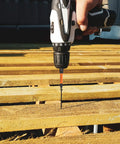 Drill using 36 Piece Torx Bit Set With Tamper Resistant Security Star Bits T5 Through T40 In S2 Steel on wooden pallet