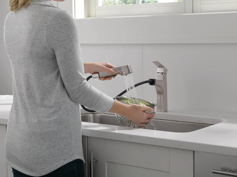 Person using Xander Pull Out Kitchen Faucet With Sprayer Stainless Steel Fits Single Hole Or 3 Hole Mount Easy Installation Built To Last Modern High Arc Kitchen Tap With Lifetime Warranty