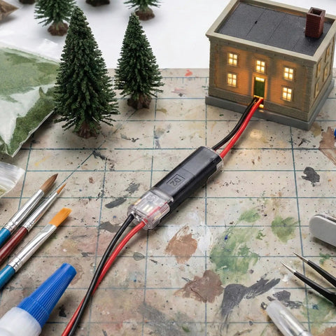 60 Pcs Quick Clip Wire Connectors Set For 18 To 22 AWG Low Voltage LED Strips shown connecting model house on workbench