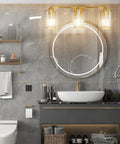3 Light Gold Vanity Light Fixture For Bathroom With Crystal Accents Over Mirror, enhancing modern bath with sleek look.