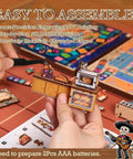 Hands assembling Day Of The Dead Book Nook Kit For Adults And Teens, colorful 3D wooden dollhouse scene with detailed pieces.