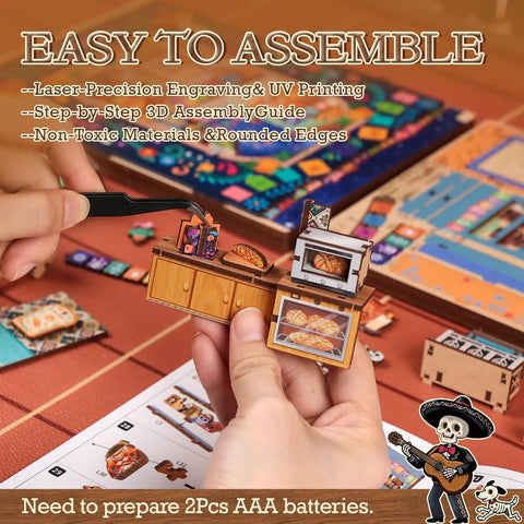 Hands assembling Day Of The Dead Book Nook Kit For Adults And Teens, colorful 3D wooden dollhouse scene with detailed pieces.