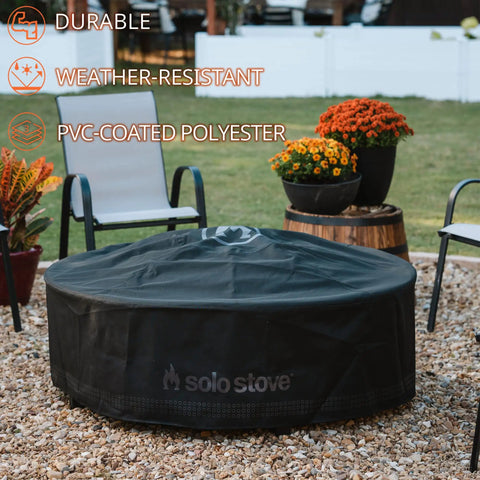 Surround Shelter Small Fire Pit Surround Cover for heavy duty weatherproof protection on outdoor patio with chairs and flowers.