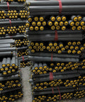 Heavy Duty Unpowered Steel Roller Set For Factories And Warehouses Easy Install Spring Loaded Conveyor Guide Rollers stacked in warehouse.