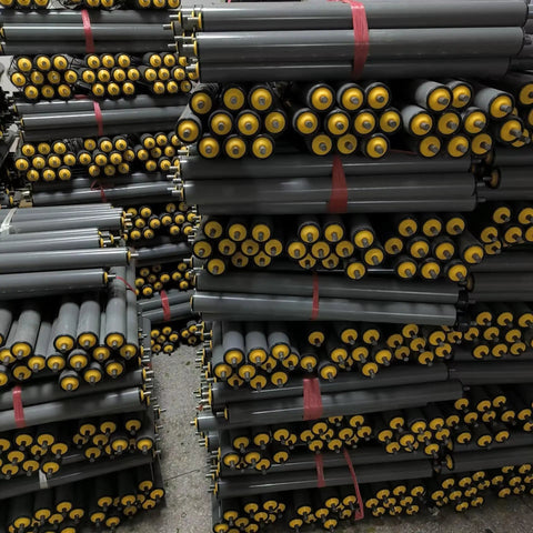 Heavy Duty Unpowered Steel Roller Set For Factories And Warehouses Easy Install Spring Loaded Conveyor Guide Rollers stacked in warehouse.