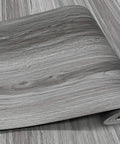 Real Wood Look Vinyl Floor Roll Featuring Dead Simple Peel And Stick Setup Super Wide Layout, grey wood grain design.
