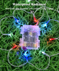 Red White and Blue Battery Operated Outdoor Lights With Timer About Ten Feet Long 30 LED Waterproof For Fourth Of July Independence Day Decorations Garland Patio Or Garden Party Decor Easy Setup shown coiled in grass.