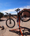 Tri Doc Cycling Stand A Stable Folding Aluminum Non Slip Tri Leg Trail Doc Stand With Rubber Covered Legs And Easy Clamp System