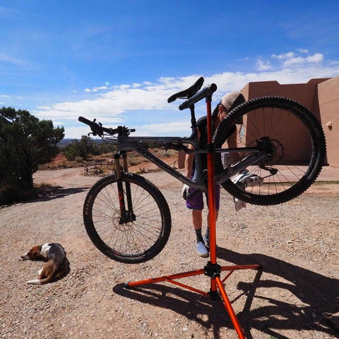 Tri Doc Cycling Stand A Stable Folding Aluminum Non Slip Tri Leg Trail Doc Stand With Rubber Covered Legs And Easy Clamp System