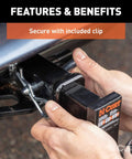 Close-up of hands installing a half inch trailer hitch pin and clip for one and a quarter inch receivers in Class 1 and 2 hitches.