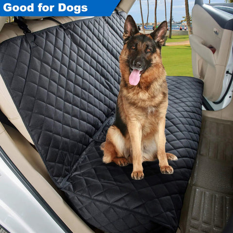 Heavy Duty Waterproof Bench Car Seat Cover Protector For Dogs Nonslip Universal Fit For Cars Trucks And SUVs Keeps Upholstery Safe From Fur Scratches And Urine Perfect For Pets And Passengers Black with dog seated on quilted fabric in car.