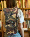 Go To Lightweight Hiking Backpack For Women, Oxford Cloth Daypack In Jungle Camo worn by woman indoors