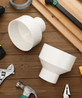 2 Pack 4 Inch By 2 Inch PVC Reducer Coupling Adapter Socket To Socket Fittings with tools on wooden surface