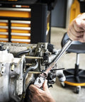Using 120XP Flex Head Ratchet Set, 3-Piece, 60-Tooth Gear, Double-Stacked Pawls on engine for angled access in shop