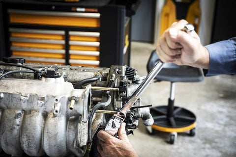 Using 120XP Flex Head Ratchet Set, 3-Piece, 60-Tooth Gear, Double-Stacked Pawls on engine for angled access in shop