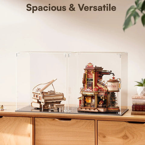 Crystal Clear Acrylic Display Case For Collectibles For 2 wooden model kits on a desk, clear plastic base, dust proof