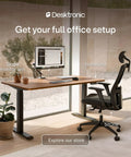 Desktronic HomeOne 60x30 Electric Standing Desk Sit Stand Home Office with walnut surface and monitor arm setup.