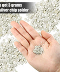 Hand holding Three Gram Silver Chip Solder For Jewelry Making Precut 2x2 mm Flux Chips Easy Solder Medium Density Ultra Tiny Silver Solder