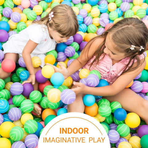 Children playing in a colorful indoor ball pit with various colored plastic balls.