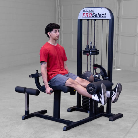 Built Tough Leg Extension And Curl Machine With A Massive 310 Lb Weight Stack in use, featuring a seated user adjusting the machine.