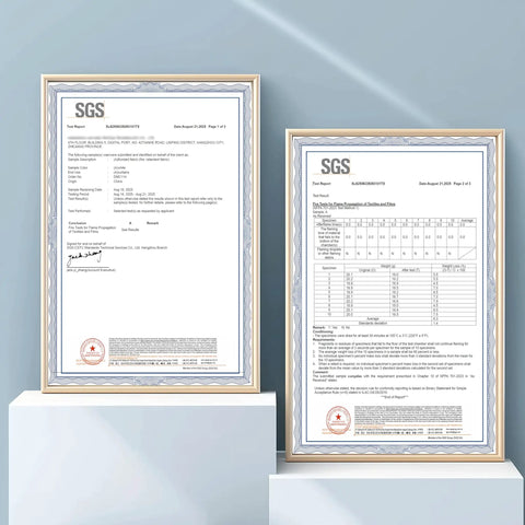 Framed SGS certification documents for Totally Blackout Flame Resistant Curtain With NFPA 701 Safety displayed on a shelf.