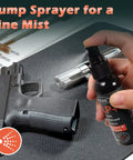 Hand using 4 In 1 CLP Gun Lubricant Kit with 2 oz fine mist sprayer near pistol and cleaning tools