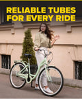 Woman posing with cruiser bike featuring Heavy Duty 26 Inch Bike Inner Tube Set of 2 with Presta Valve, Fits 26 X 1.75 To 2.125 Tire Widths