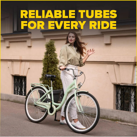 Woman posing with cruiser bike featuring Heavy Duty 26 Inch Bike Inner Tube Set of 2 with Presta Valve, Fits 26 X 1.75 To 2.125 Tire Widths