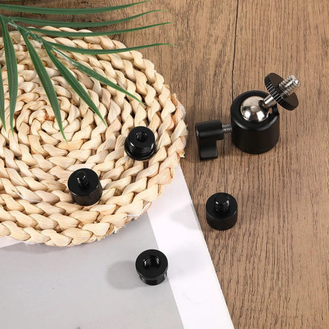 Flexible Ball And Socket Head Microphone Adapter Kit With Four Adapters on wicker mat and wooden surface