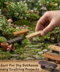 Hand placing bench from 18 Pc Dope Mini Resin Bench Set For Fairy Garden Dollhouse Accessories Park Decor And Mini Landscape Scenes