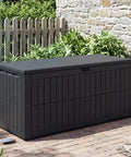 Big 120 Gallon Outdoor Deck Box Lockable Waterproof Storage Chest for Patio Cushions, garden tools by a stone wall and plants