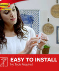 Woman holding Damage Free Wall Hooks With Adhesive Strips Set Of 2 Hooks And 4 Strips, No Tools Required, demonstrating use.