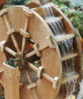 Pillow block bearing UCP204-12 with 3/4 in bore and green housing mounted on a wooden water wheel