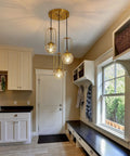 Three Light Mid Century Modern Pendant Light Fixture With Gold Finish Glass Globe And Adjustable Cage Hanging Chandelier