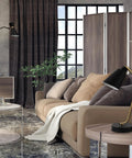 Living room with Industrial Luxe 17 Inch Desk Lamp in Matte Black with Antique Brass Accents on side table.