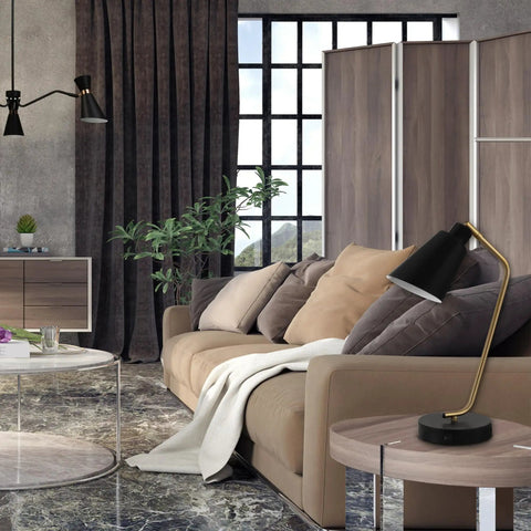 Living room with Industrial Luxe 17 Inch Desk Lamp in Matte Black with Antique Brass Accents on side table.