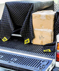 Heavy Duty Moving Blanket With Padded Cushioned Comfort For Every Move Non Woven Fabric 80 By 72 Inches covering boxes in a truck bed