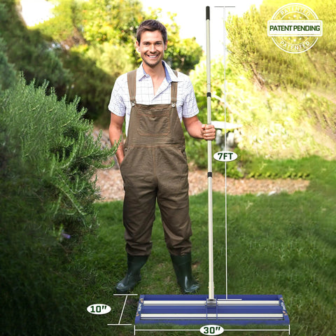 Man holding Beefed Up Lawn Leveling Rake With Aluminum Roller Base And Stainless Steel Construction 30 By 10 Inch, blue rake.