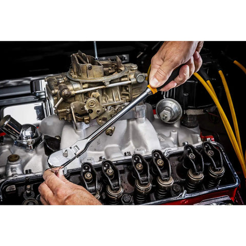 Person using Two Piece Ratchet Set With One Quarter And Three Eighth Inch Drives 90 Tooth Cushion Grip Flex Head on engine