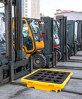 Shop Ready Heavy Duty Spill Containment Platform With Drain And Non Slip Large Plastic Tray in front of forklifts