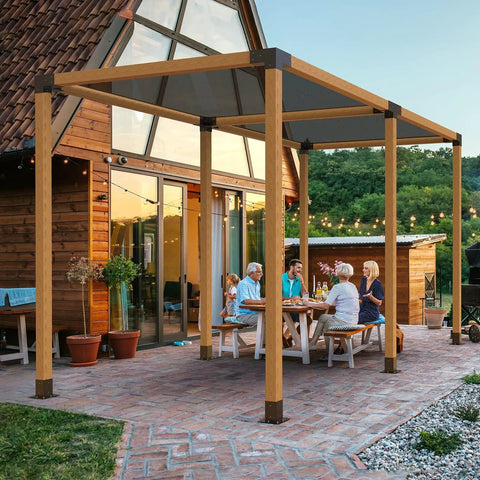 Outdoor pergola with Four Way 4x4 Pergola Brackets Heavy Duty Tough As Nails Corner Brackets For Wood Beams Easy Installation For Outdoor Gazebos Patios Log Cabins 2 Pack Post Base Hardware To Stop Rot And Sun Damage Weatherproof installed on a patio with people gathered underneath.