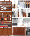 TLKKUE leather tooling kit in brown leather roll with hand tools, thread spools, and assorted leatherworking accessories