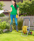 Woman using a Heavy Duty 304 Stainless Steel Garden Hose 3ft Leakproof Flexible Leader Hose for outdoor watering