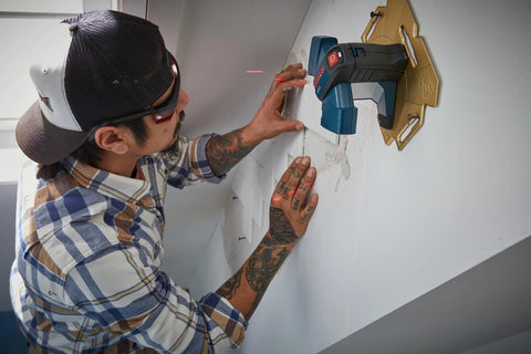 Person using 65 Feet Wall And Floor Tile Laser Level With 0 To 90 Degree Layout Lines And 45 Degree Beam For Diagonal Layouts