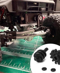 RC crawler underside with Overdrive Helical Gear Set 2-12T For 1/24 Axial SCX24 Crawler Upgrades With Steel Worm Gears shown