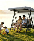 Two adults seated on 3-seat outdoor swing with Heavy Duty Swing Canopy Cover For 3 Seat Outdoor Swings Waterproof All Weather Patio Shield Tough As Nails Universal Fit Garden Backyard Furniture Cover For Porch Swings Durable Gray Large Top