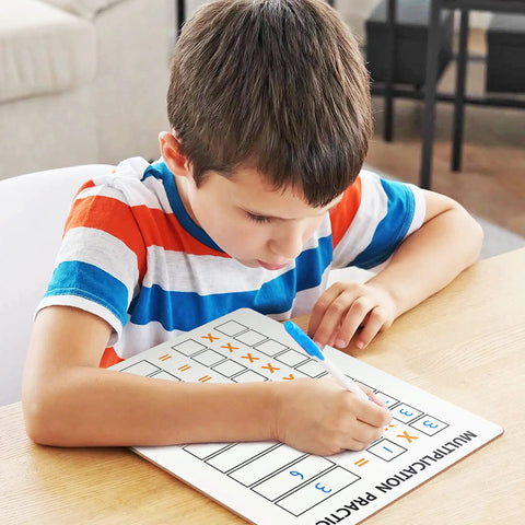 Child using Dry Erase Multiplication Board 9x12 Inch Double Sided Times Table Whiteboard With Easy Wipe Coating For Kids And Students
