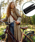 Sturdy Aluminum Bike Seat Post Shim Adapter 28.6 To 31.8 Mm Insert, Black, shown with woman on city bike in park.